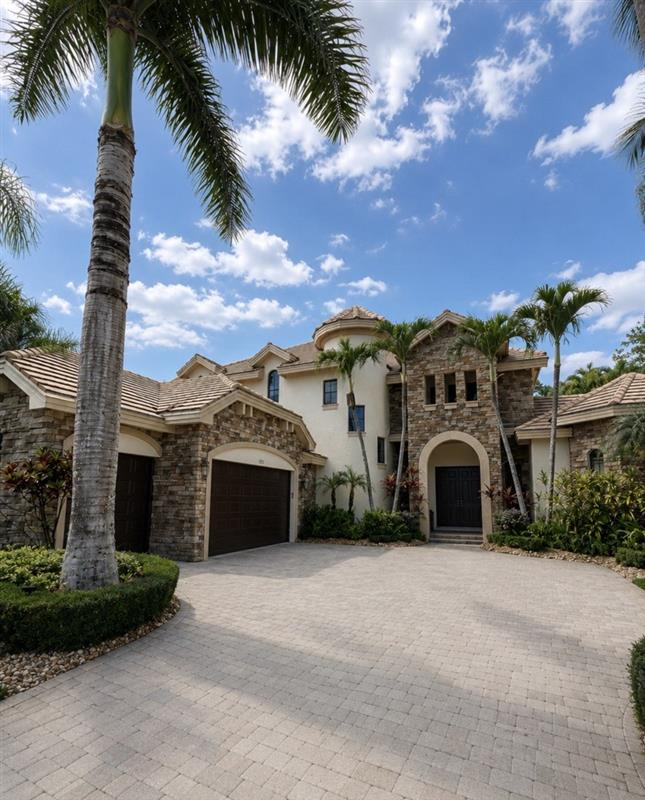 Completed exterior repaint on a stone-and-stucco Palm Beach County estate